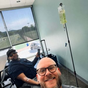Stephen Thomas receiving IV hydration therapy with Vital Flow before the performance