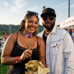 Stephen Thomas with the fan he presented a gold rose to at the Woody Fest